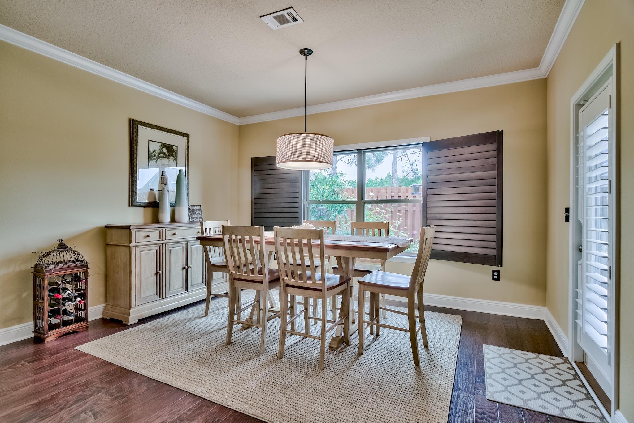 386 Pin Oak Loop Santa Rosa Beach, FL 32459 - Photo 16 of 47 a dining room with furniture and window