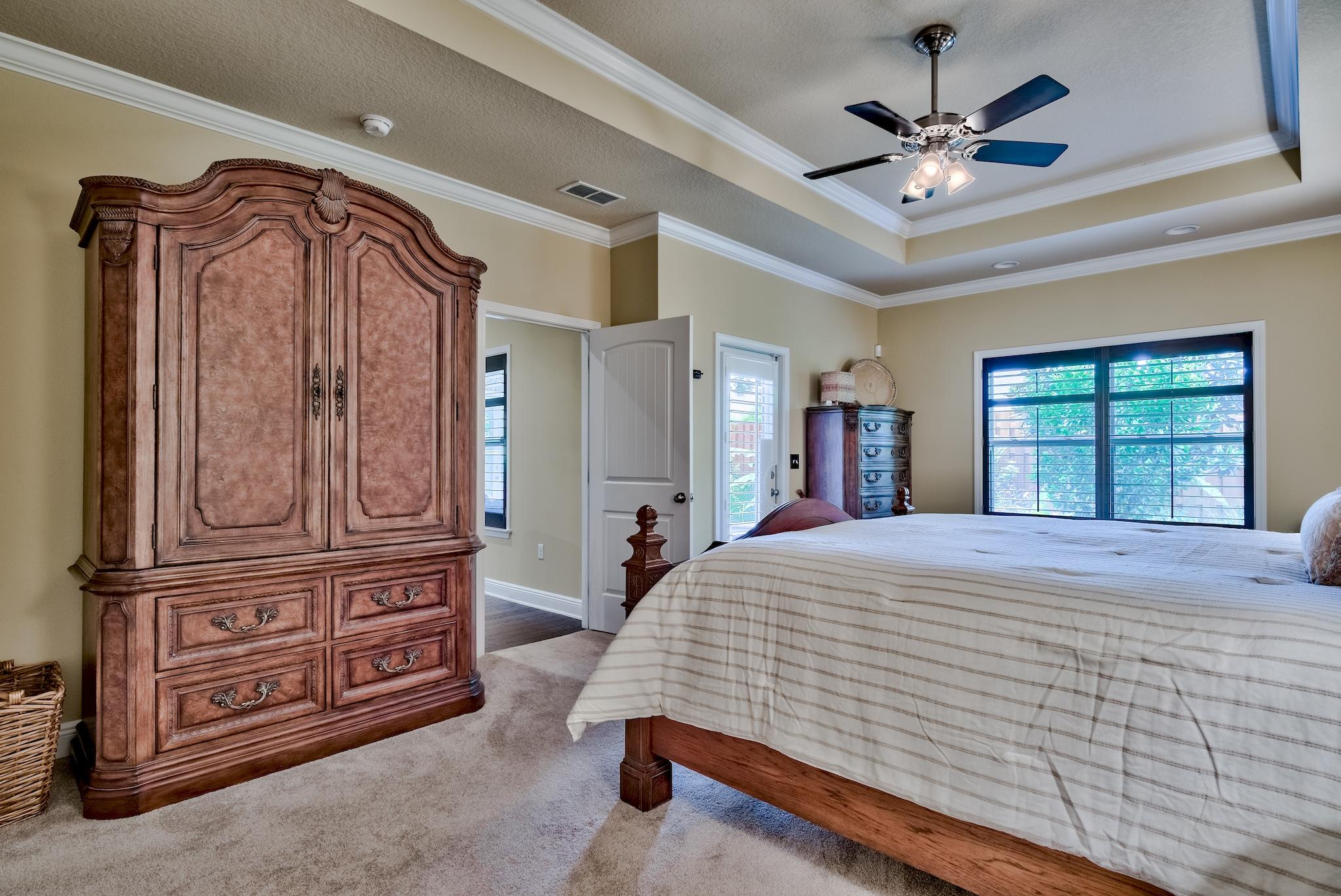 386 Pin Oak Loop Santa Rosa Beach, FL 32459 - Photo 19 of 47 a bedroom with a bed dresser and a window