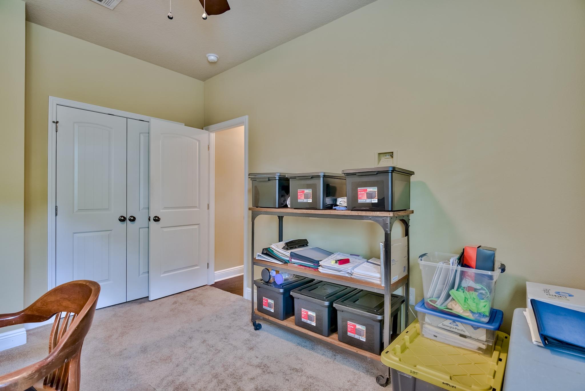 386 Pin Oak Loop Santa Rosa Beach, FL 32459 - Photo 27 of 47 a bedroom with bed and a closet