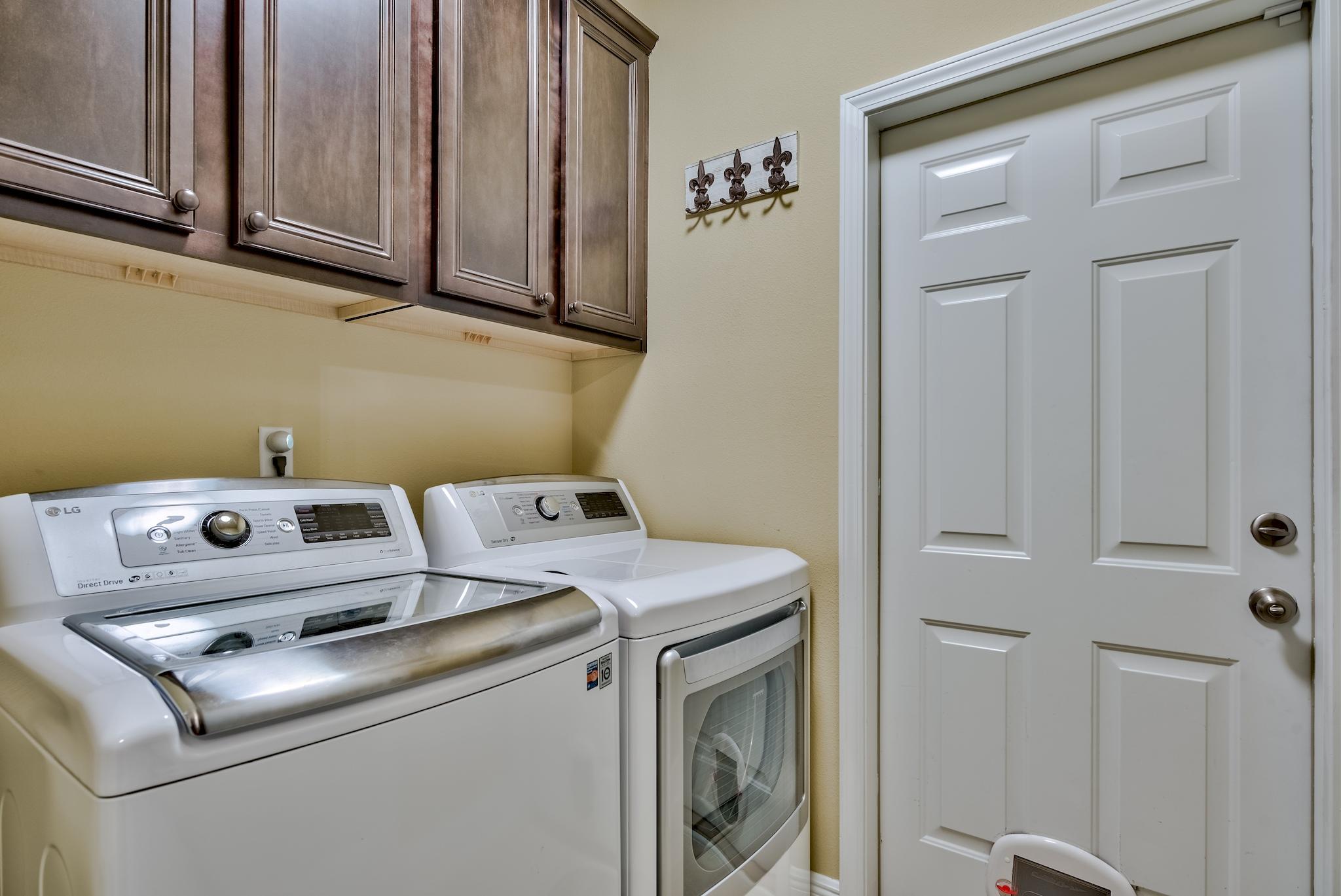 386 Pin Oak Loop Santa Rosa Beach, FL 32459 - Photo 28 of 47 a utility room with dryer and washer