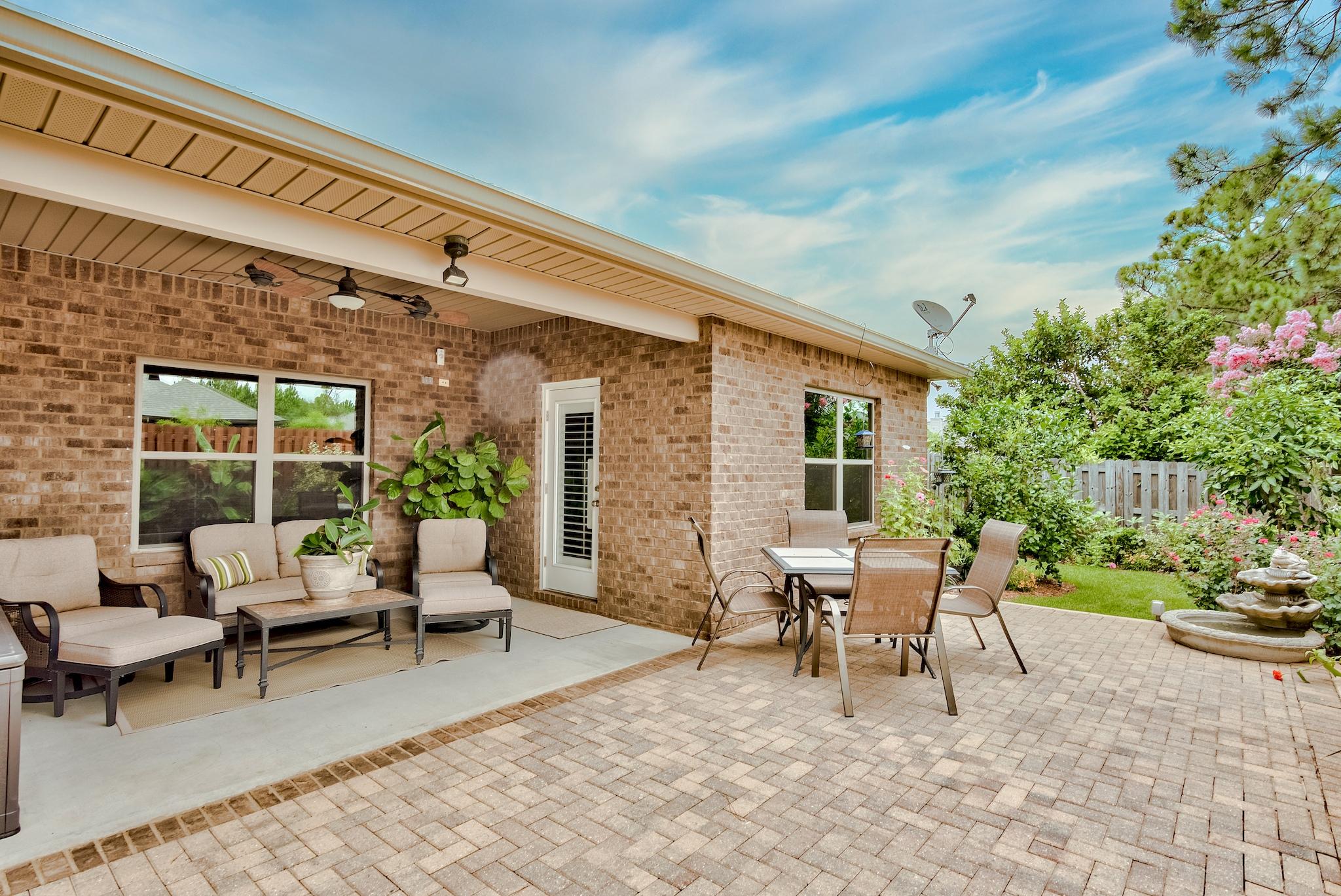 386 Pin Oak Loop Santa Rosa Beach, FL 32459 - Photo 31 of 47 a building outdoor space with patio furniture and potted plants