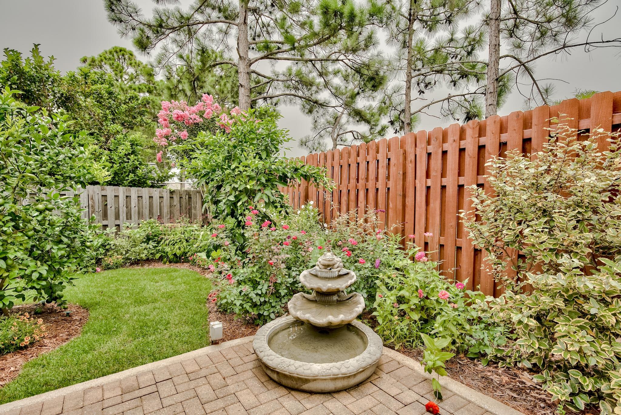 386 Pin Oak Loop Santa Rosa Beach, FL 32459 - Photo 35 of 47 a view of a garden with plants