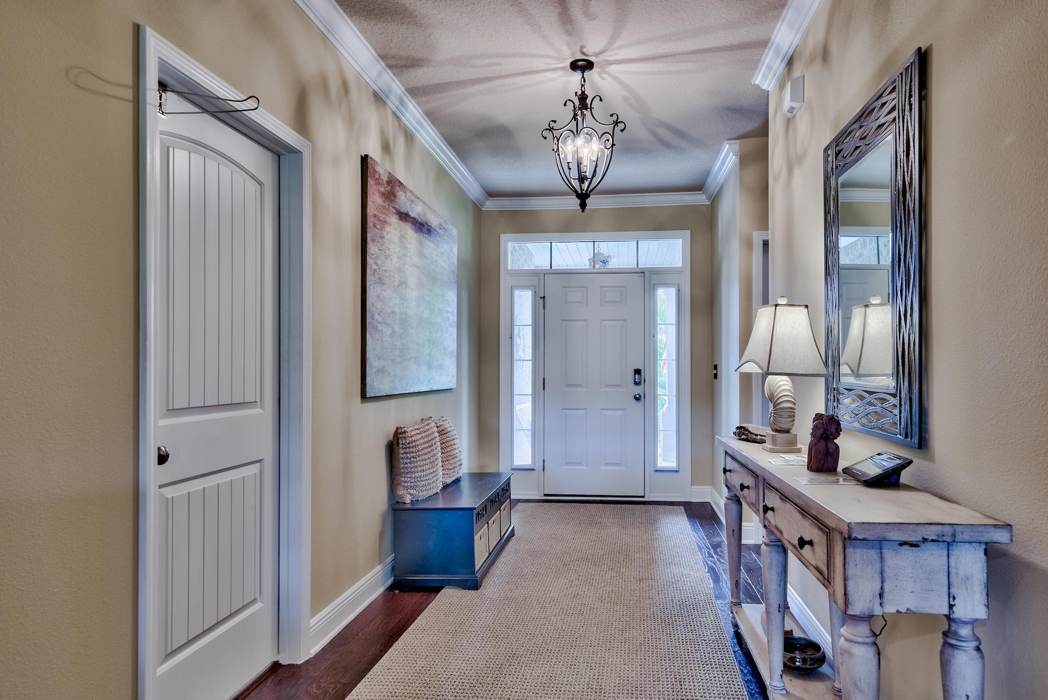 386 Pin Oak Loop Santa Rosa Beach, FL 32459 - Photo 8 of 47 a view of an entryway with a chandelier