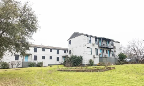 a house view with swimming pool in front of it