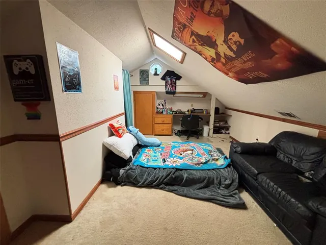 a bedroom with furniture and a wooden floor