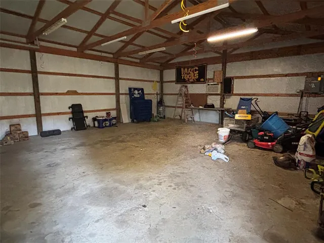 a view of a garage with cars