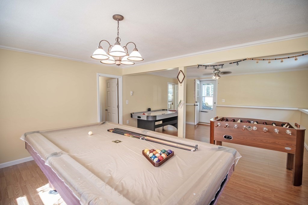 182 Ayer Road Shirley, MA 01464 - Photo 21 of 35 a view of a dining room with furniture and chandelier