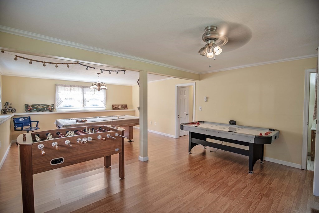 182 Ayer Road Shirley, MA 01464 - Photo 22 of 35 a view of a room with kitchen island stainless steel appliances wooden floor and window