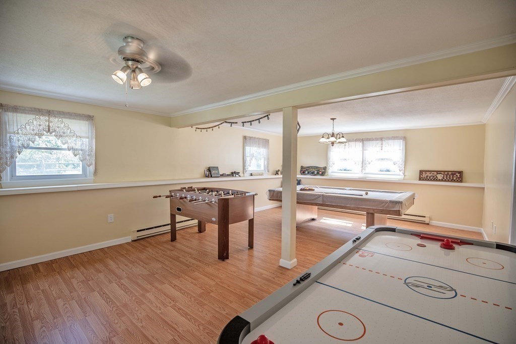 182 Ayer Road Shirley, MA 01464 - Photo 23 of 35 a room with table chairs and wooden floor