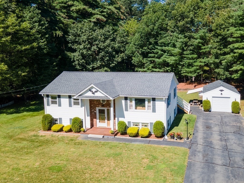 182 Ayer Road Shirley, MA 01464 - Photo 26 of 35 a view of a house with a backyard and a small yard
