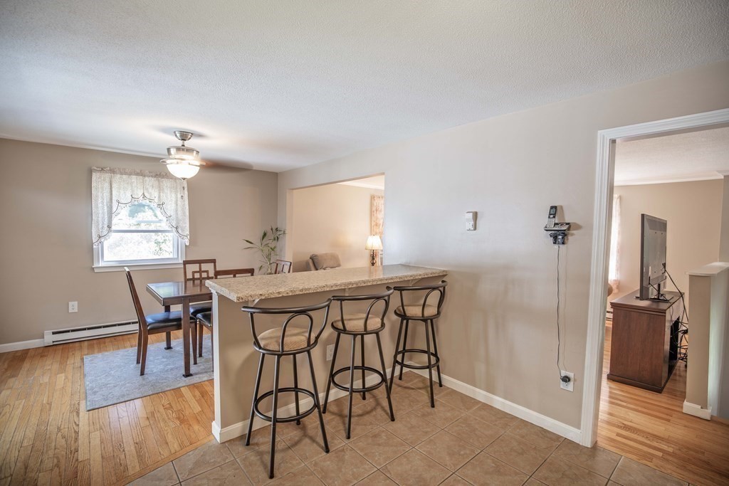 182 Ayer Road Shirley, MA 01464 - Photo 5 of 35 a view of a dining room with furniture and wooden floor