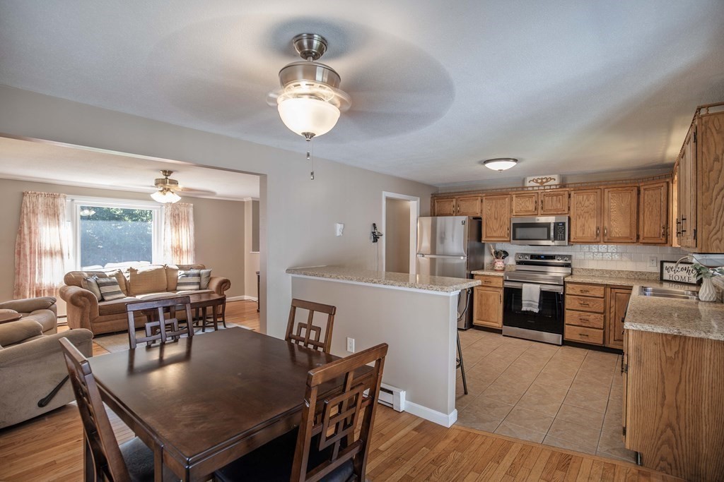 182 Ayer Road Shirley, MA 01464 - Photo 6 of 35 a view of kitchen with sink dining table and chairs