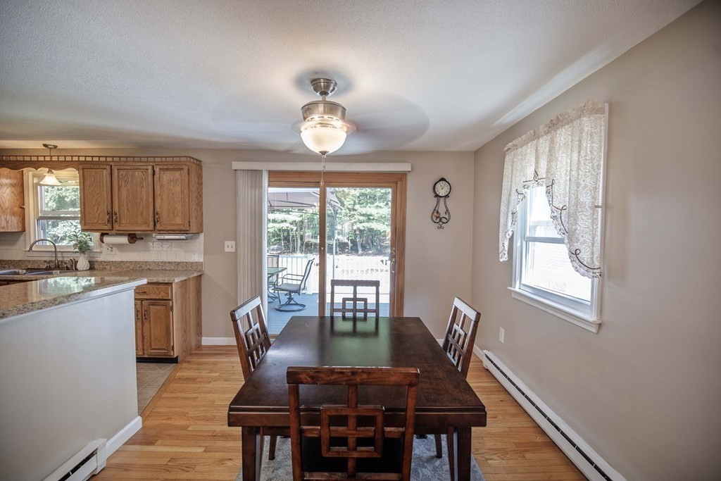 182 Ayer Road Shirley, MA 01464 - Photo 7 of 35 a view of a dining room with furniture window and wooden floor