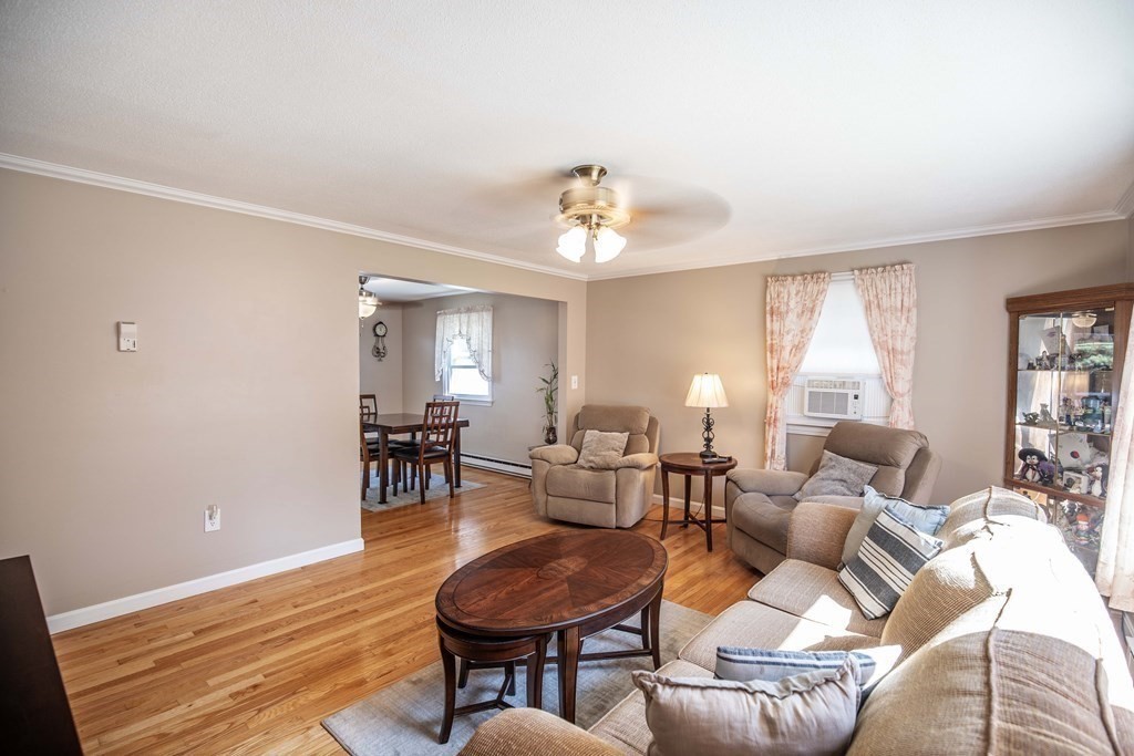 182 Ayer Road Shirley, MA 01464 - Photo 10 of 35 a living room with furniture a dining table and a fireplace