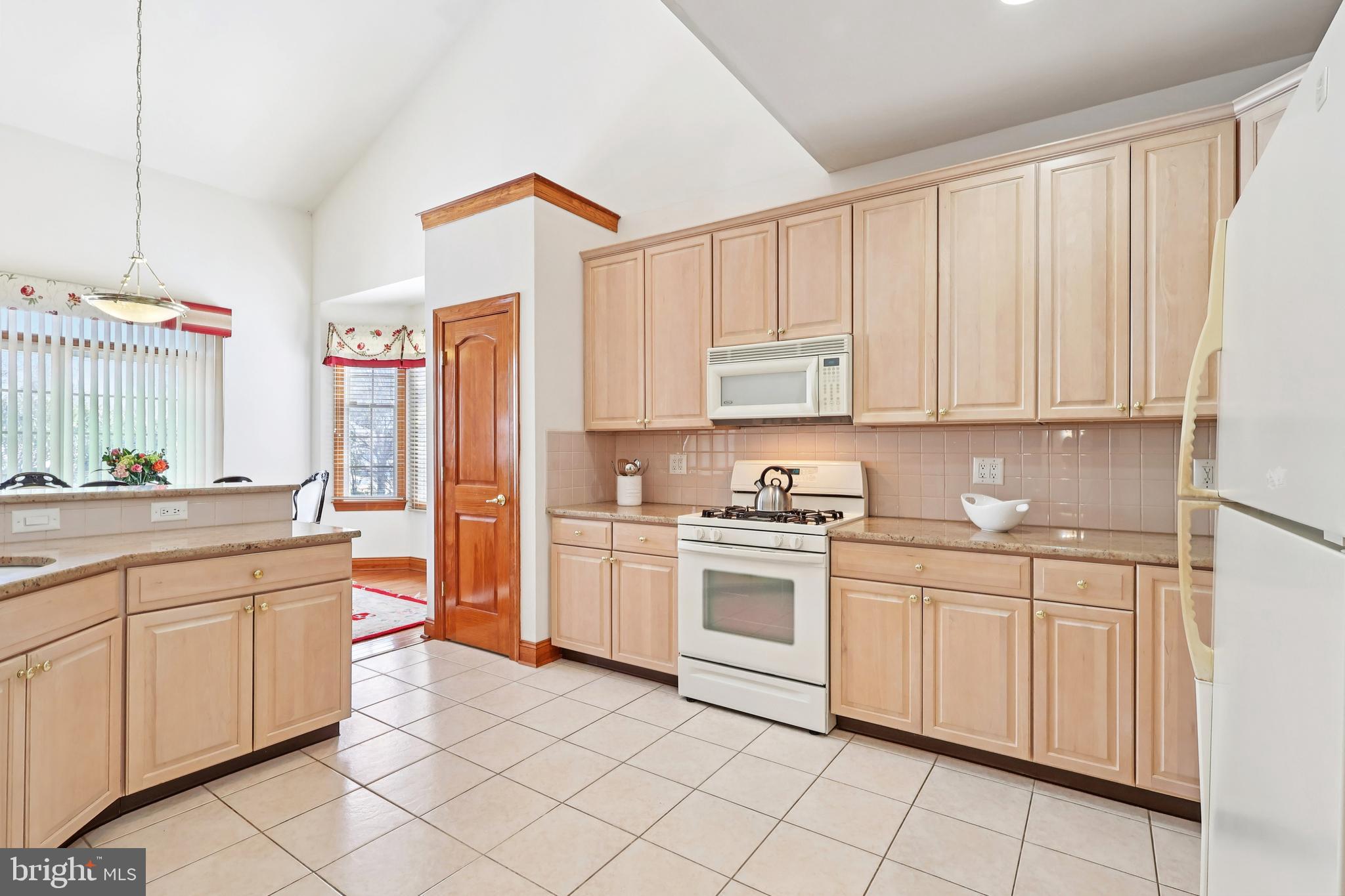 2 Kyle Court Mount Laurel, NJ 08054 - Photo 12 of 42 a kitchen with white cabinets and white appliances