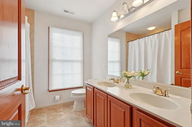 a en suite bathroom with a sink and a mirror