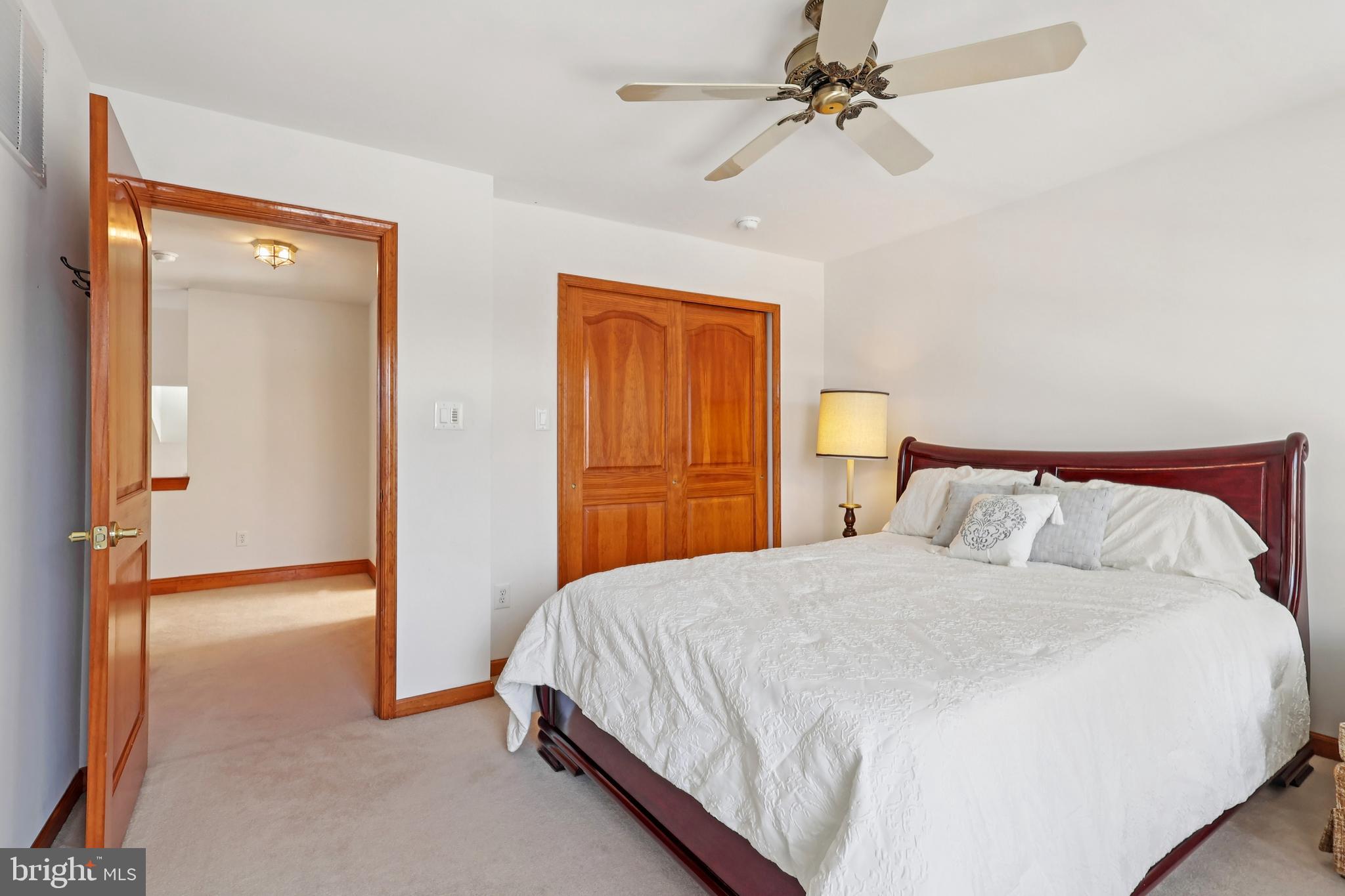 2 Kyle Court Mount Laurel, NJ 08054 - Photo 22 of 42 a bedroom with a bed and a chandelier