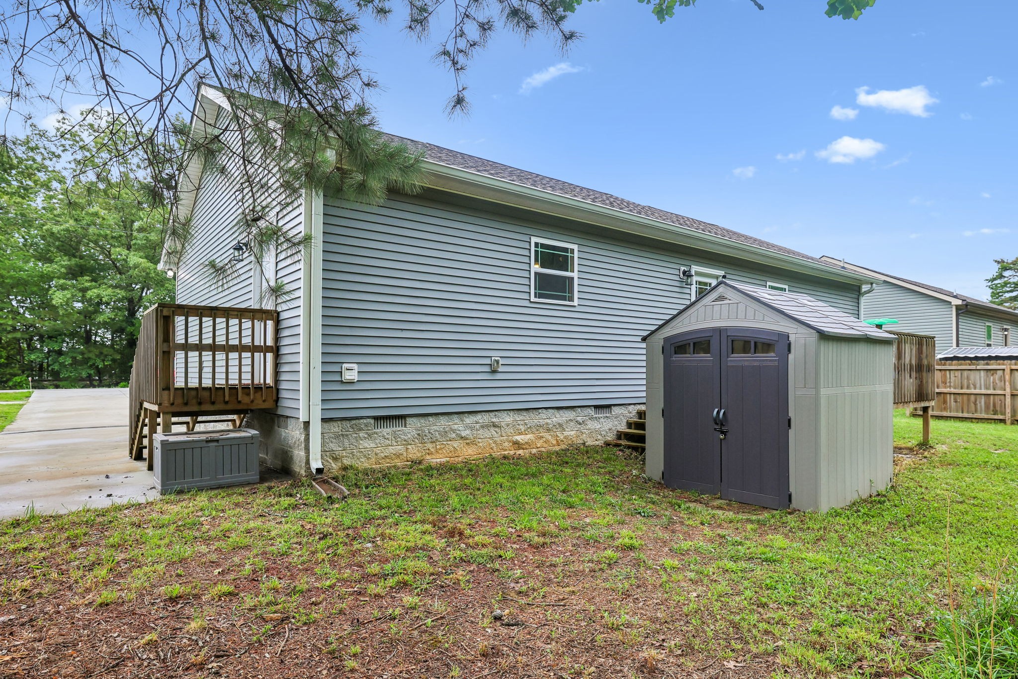 1546 South Spring Street Manchester, TN 37355 - Photo 35 of 53 a backyard of a house with lots of green space