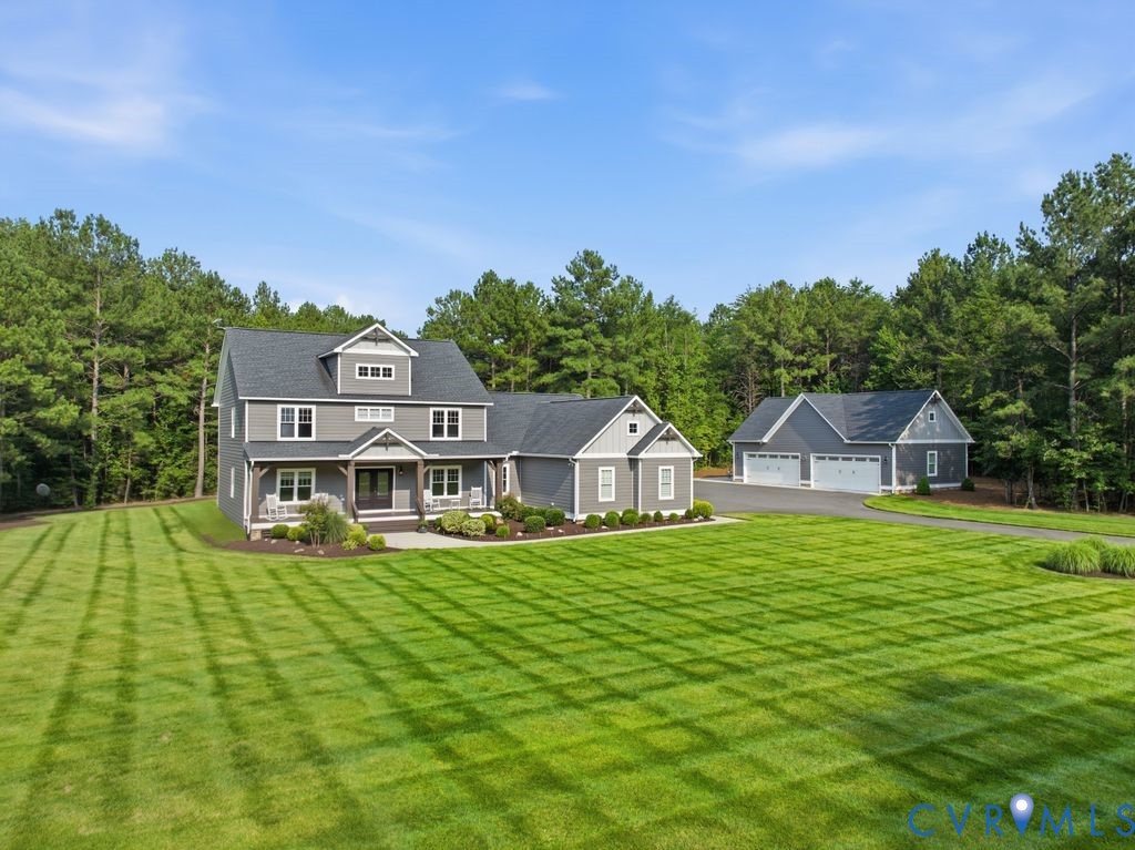 13114 Spring Road Rockville, VA 23146 - Photo 1 of 61 Expansive lawn with pattern mowing, a two-story gr