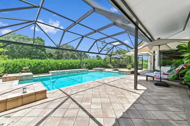 a view of a backyard with under an umbrella