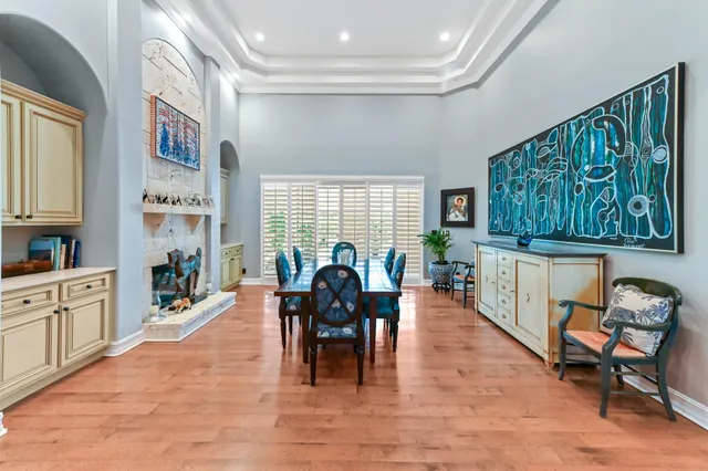 a view of a livingroom with furniture and a large window