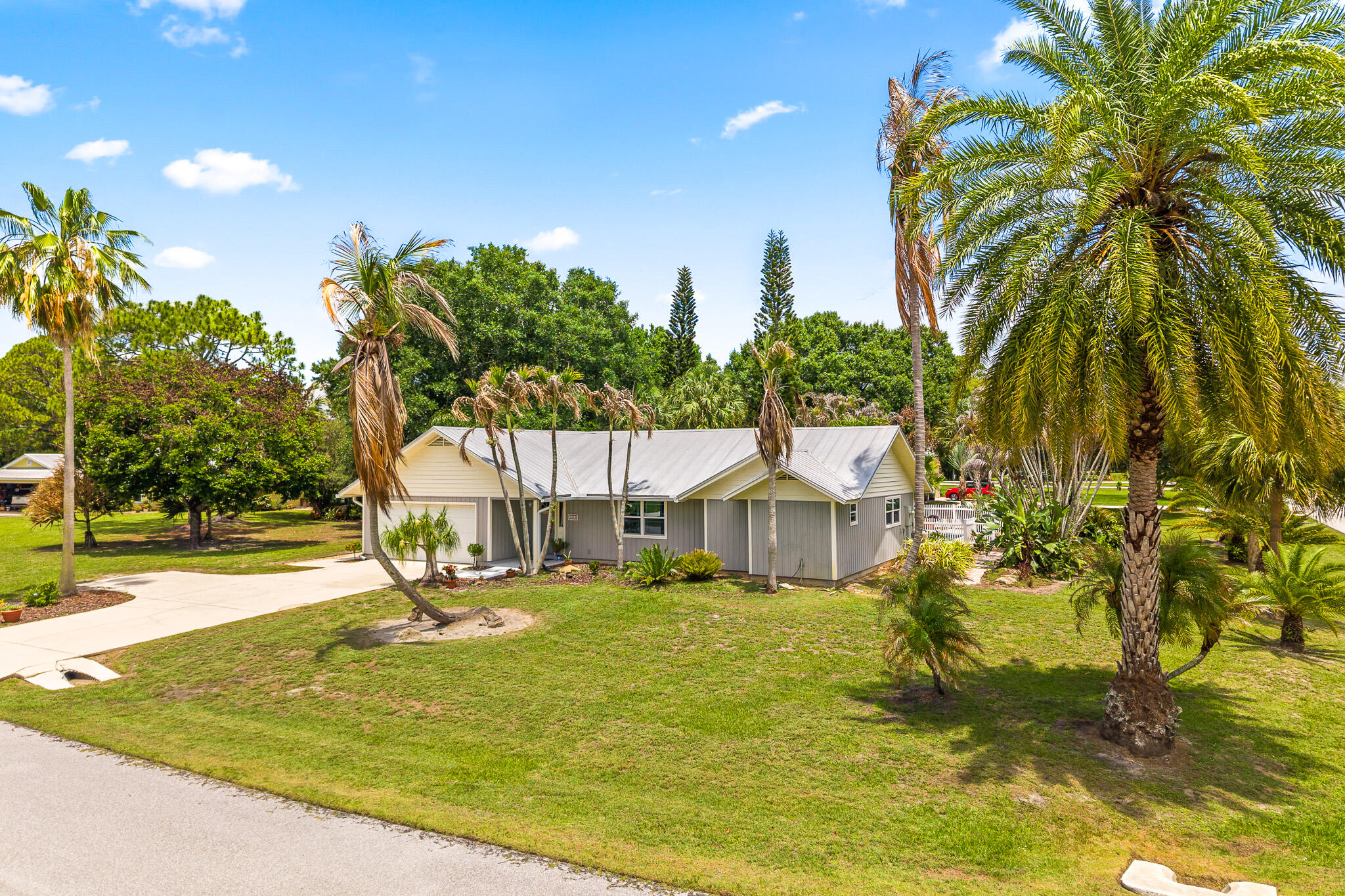 1653 Southwest 85th Terrace Stuart, FL 34997 - Photo 2 of 54 a view of a house with swimming pool and sitting area