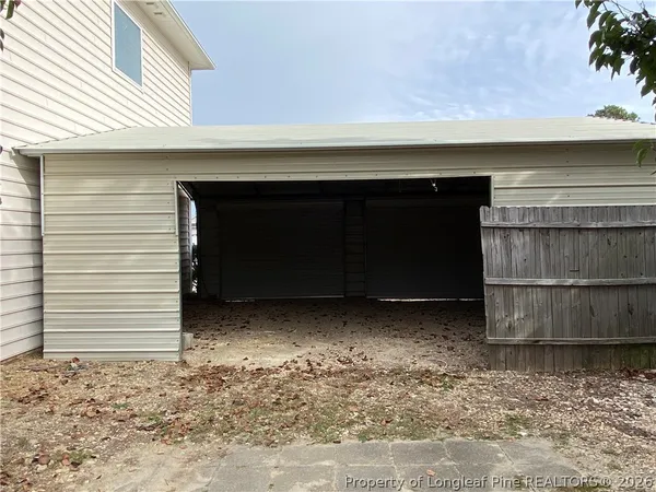 a front view of house with a garden