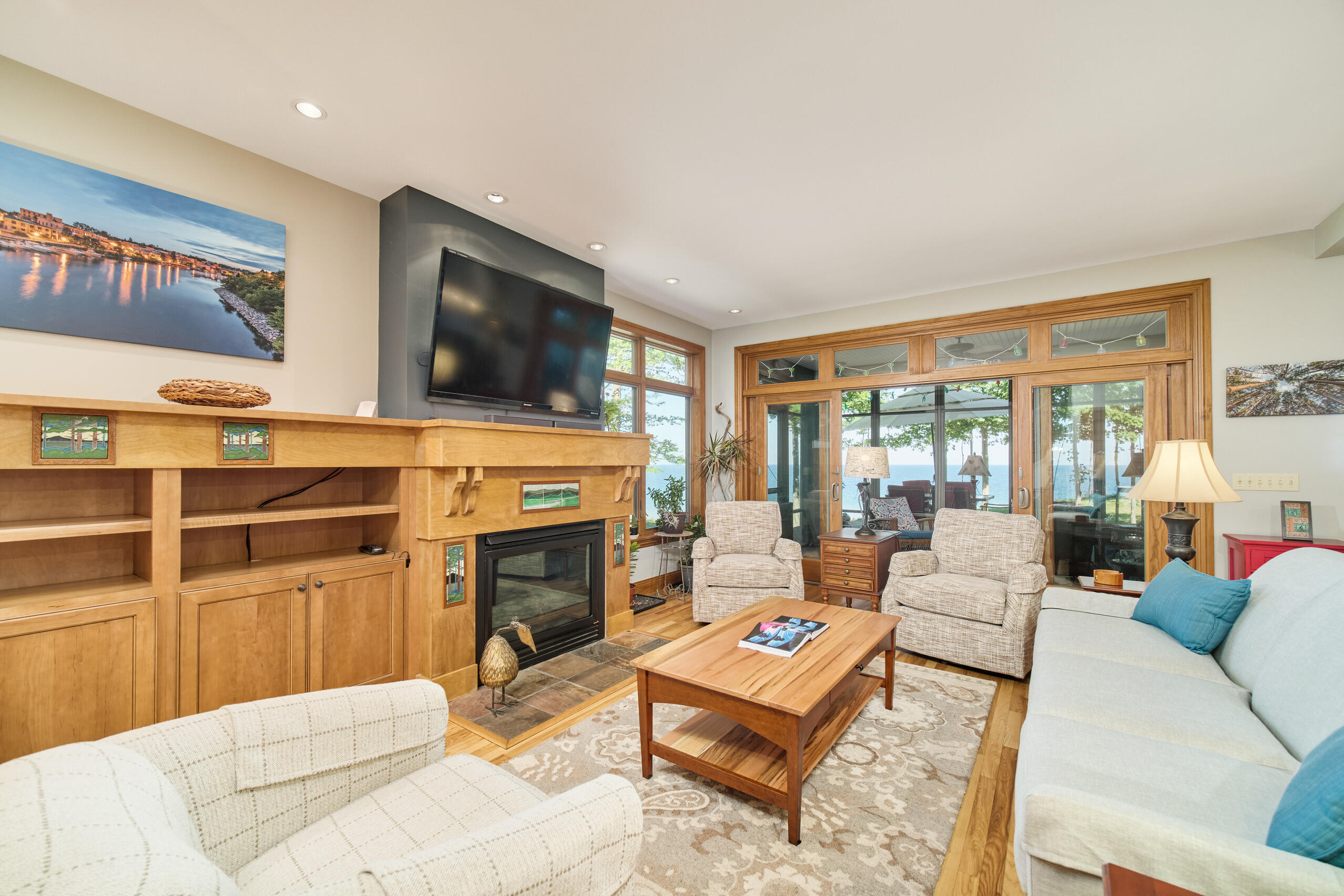 4582 West Fox Farm Road Manistee, MI 49660 - Photo 20 of 80 Living room opens to screened porch