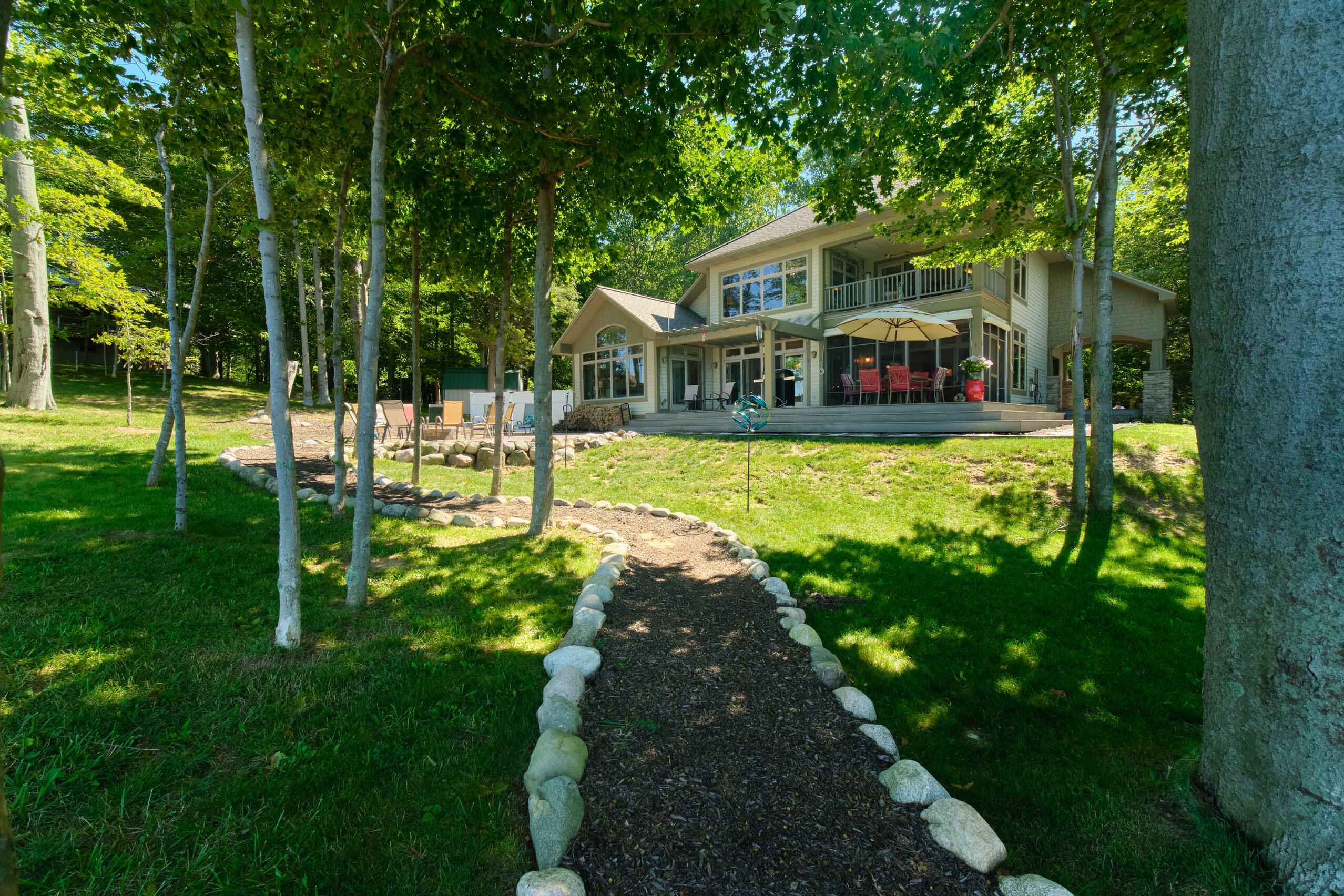4582 West Fox Farm Road Manistee, MI 49660 - Photo 2 of 80 Lake side view of home