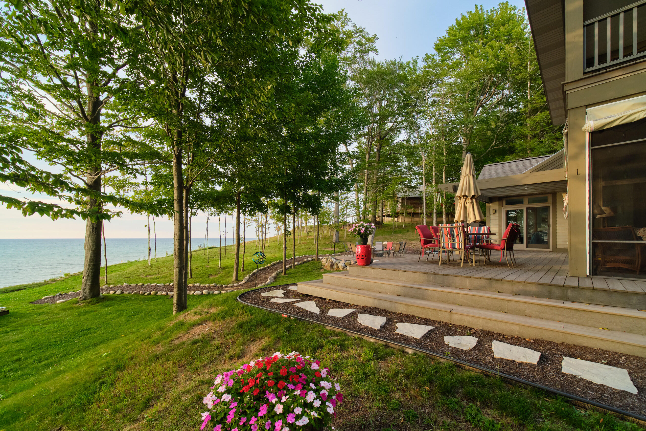 4582 West Fox Farm Road Manistee, MI 49660 - Photo 58 of 80 Lakeside yard with trimmed trees