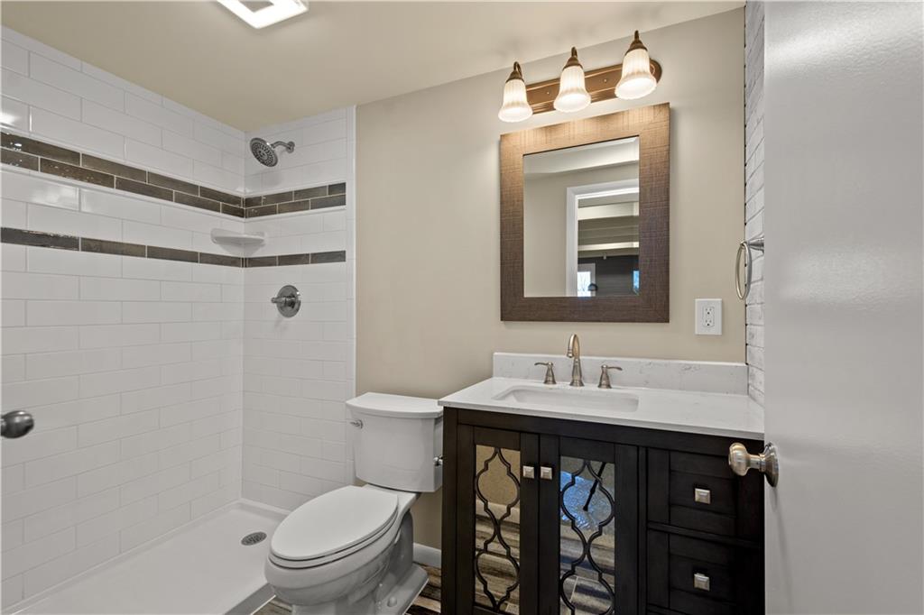 27 North Johnson Road Houston, PA 15342 - Photo 18 of 25 a bathroom with a sink vanity mirror and toilet