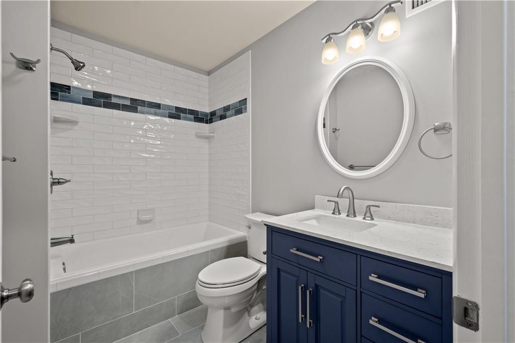 27 North Johnson Road Houston, PA 15342 - Photo 19 of 25 a bathroom with a sink a toilet and a mirror