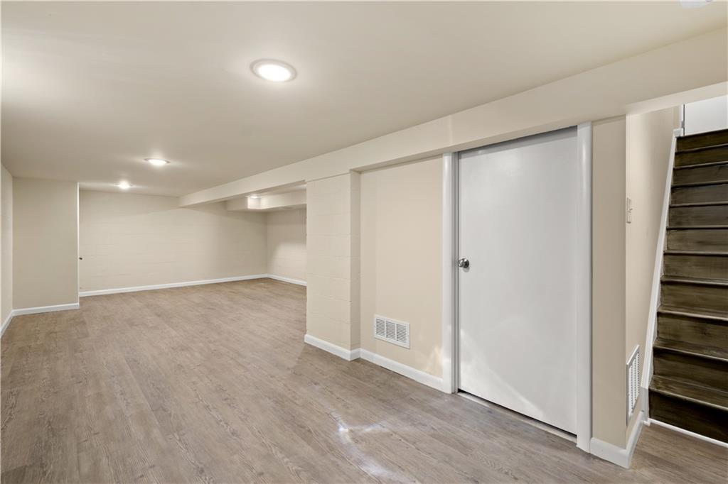 27 North Johnson Road Houston, PA 15342 - Photo 20 of 25 an empty room with wooden floor and windows