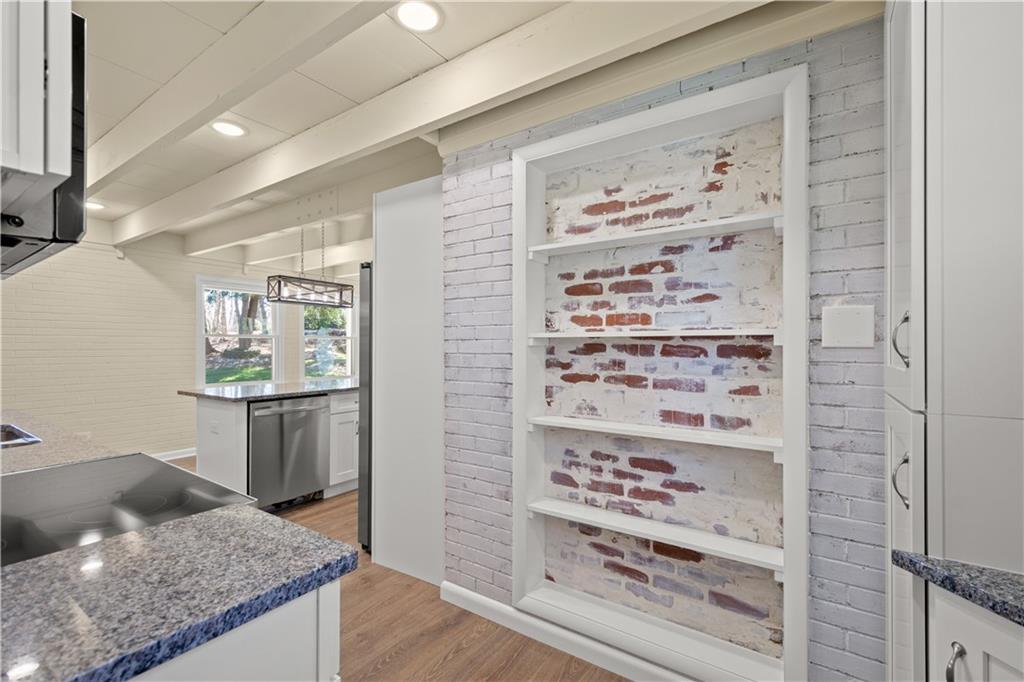27 North Johnson Road Houston, PA 15342 - Photo 7 of 25 a kitchen with granite countertop a refrigerator and a stove