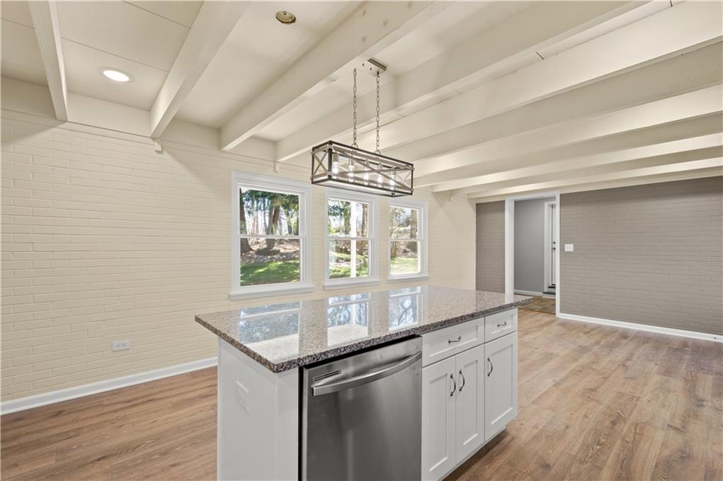 27 North Johnson Road Houston, PA 15342 - Photo 10 of 25 a kitchen with stainless steel appliances granite countertop a sink and a wooden floor