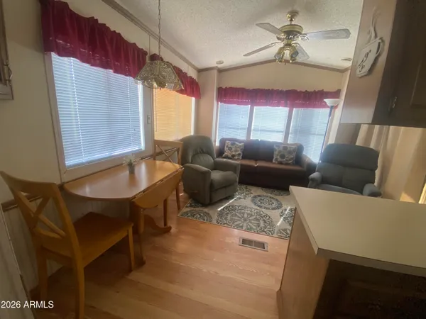 a view of deck with table and chairs