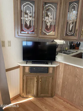 a view of a patio with plants and table and chairs