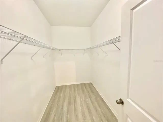 a view of a room with a shower and a roof