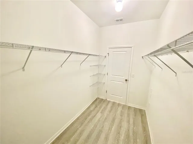 a view of a room with racks on the wall