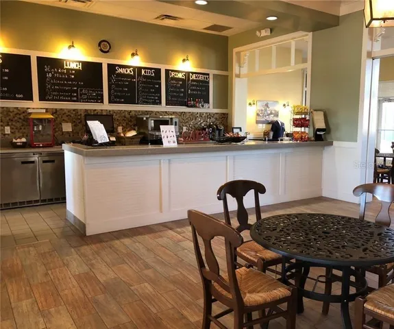 a kitchen with a table chairs and a stove