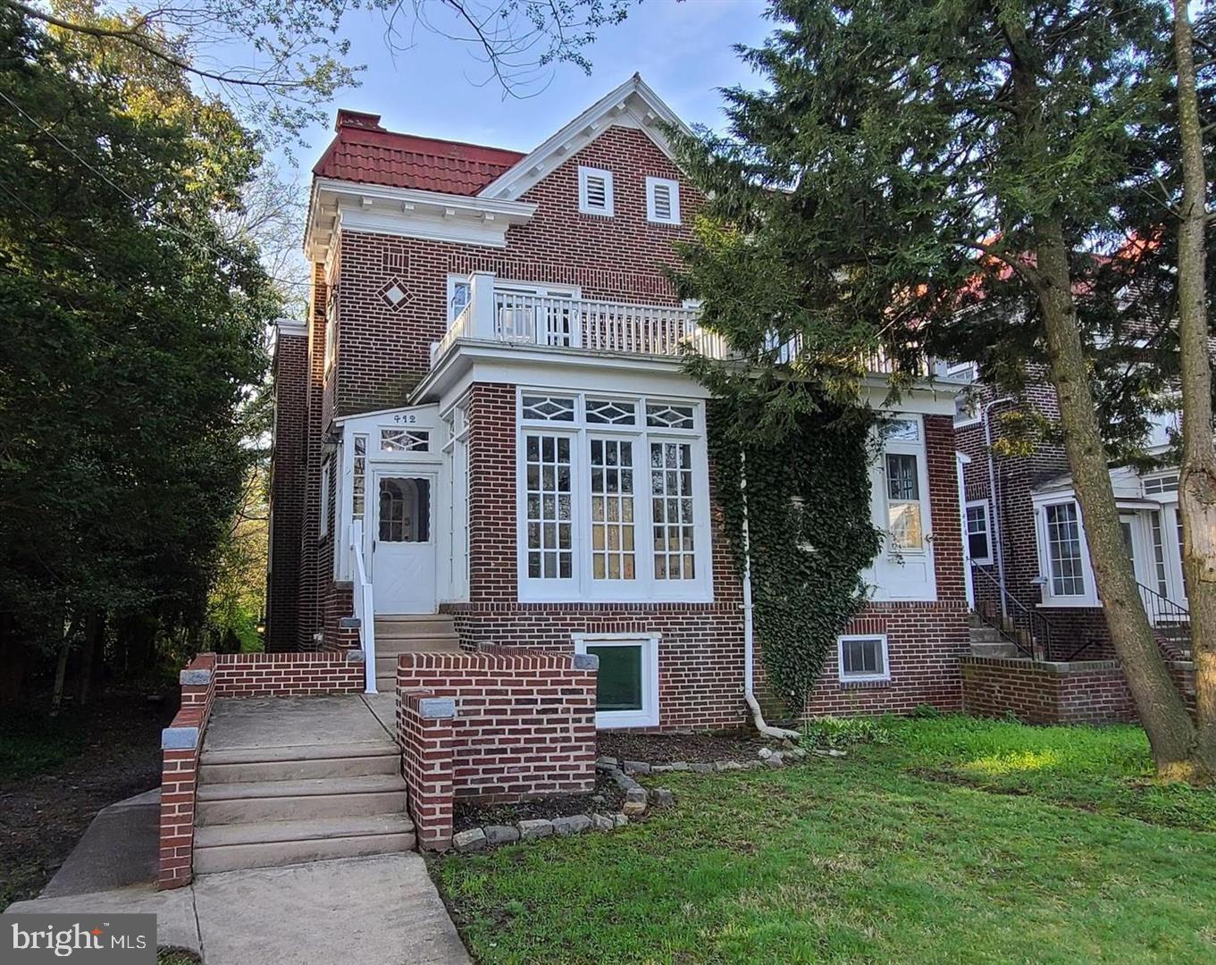 412 West Maple Avenue Merchantville, NJ 08109 - Photo 1 of 58 a front view of a house with garden
