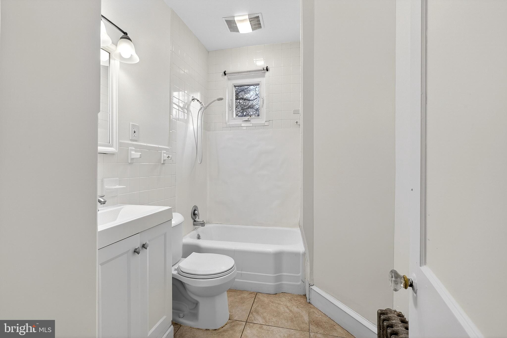 412 West Maple Avenue Merchantville, NJ 08109 - Photo 18 of 58 a bathroom with a toilet a sink and bathtub