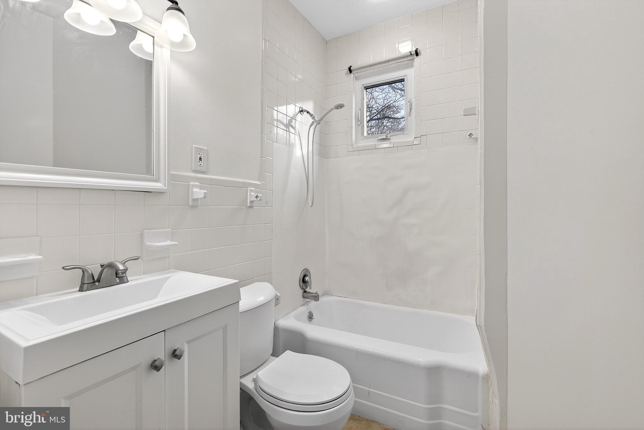 412 West Maple Avenue Merchantville, NJ 08109 - Photo 19 of 58 a bathroom with a sink a toilet and bathtub