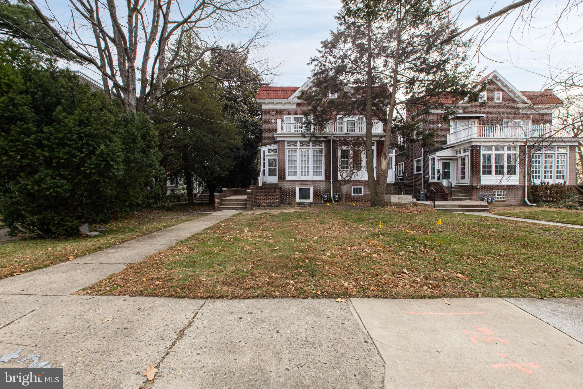 412 West Maple Avenue Merchantville, NJ 08109 - Photo 2 of 58 a brick building with trees in front of it