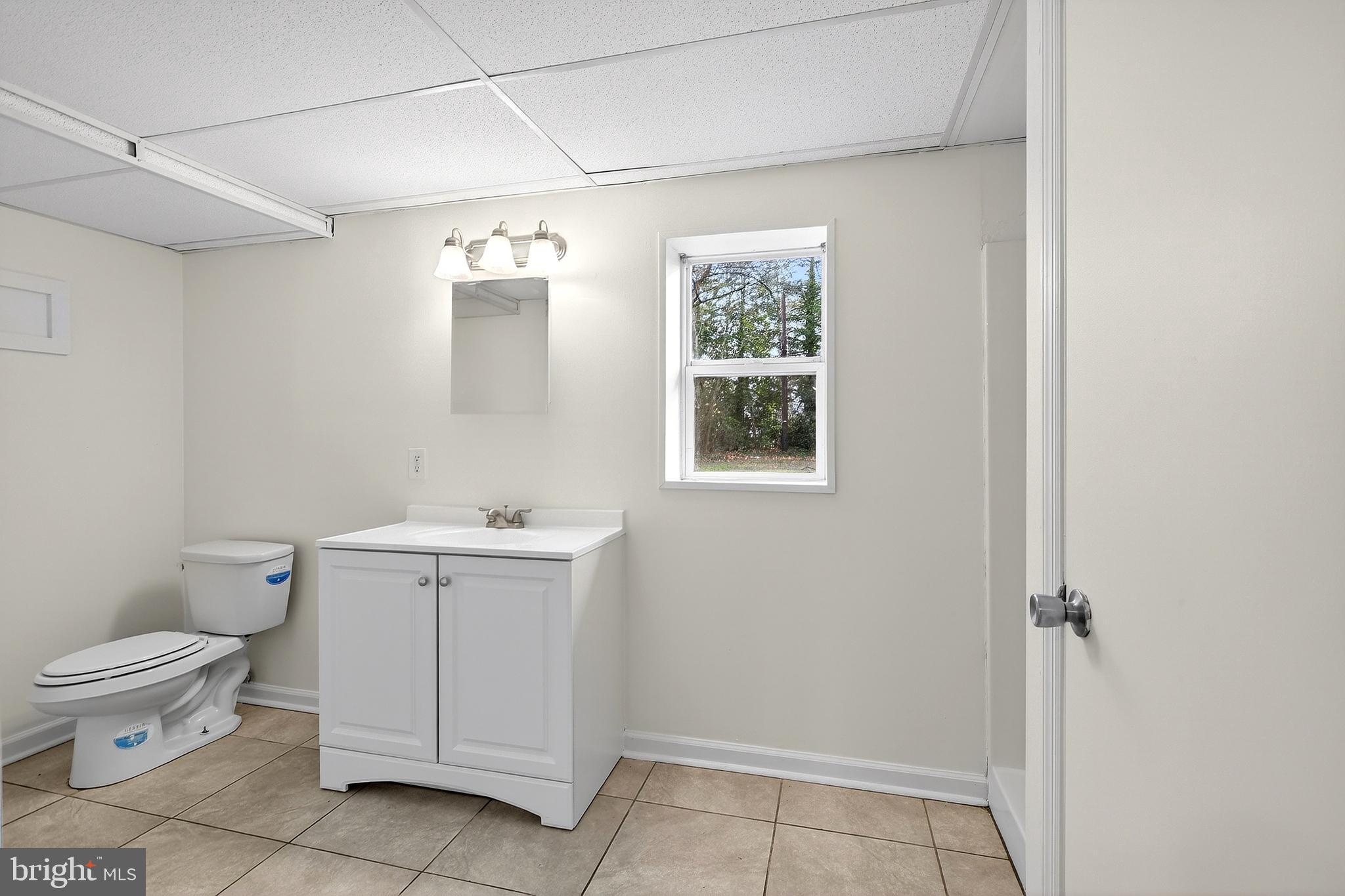 412 West Maple Avenue Merchantville, NJ 08109 - Photo 28 of 58 a white toilet sitting next to a bathroom sink