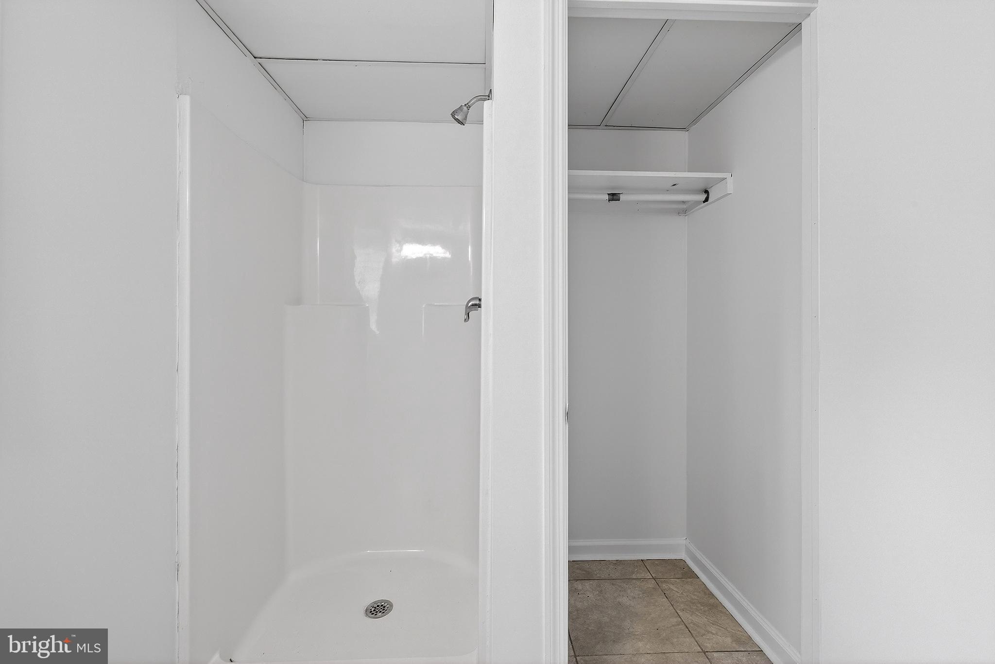 412 West Maple Avenue Merchantville, NJ 08109 - Photo 30 of 58 a bathroom with a glass shower door