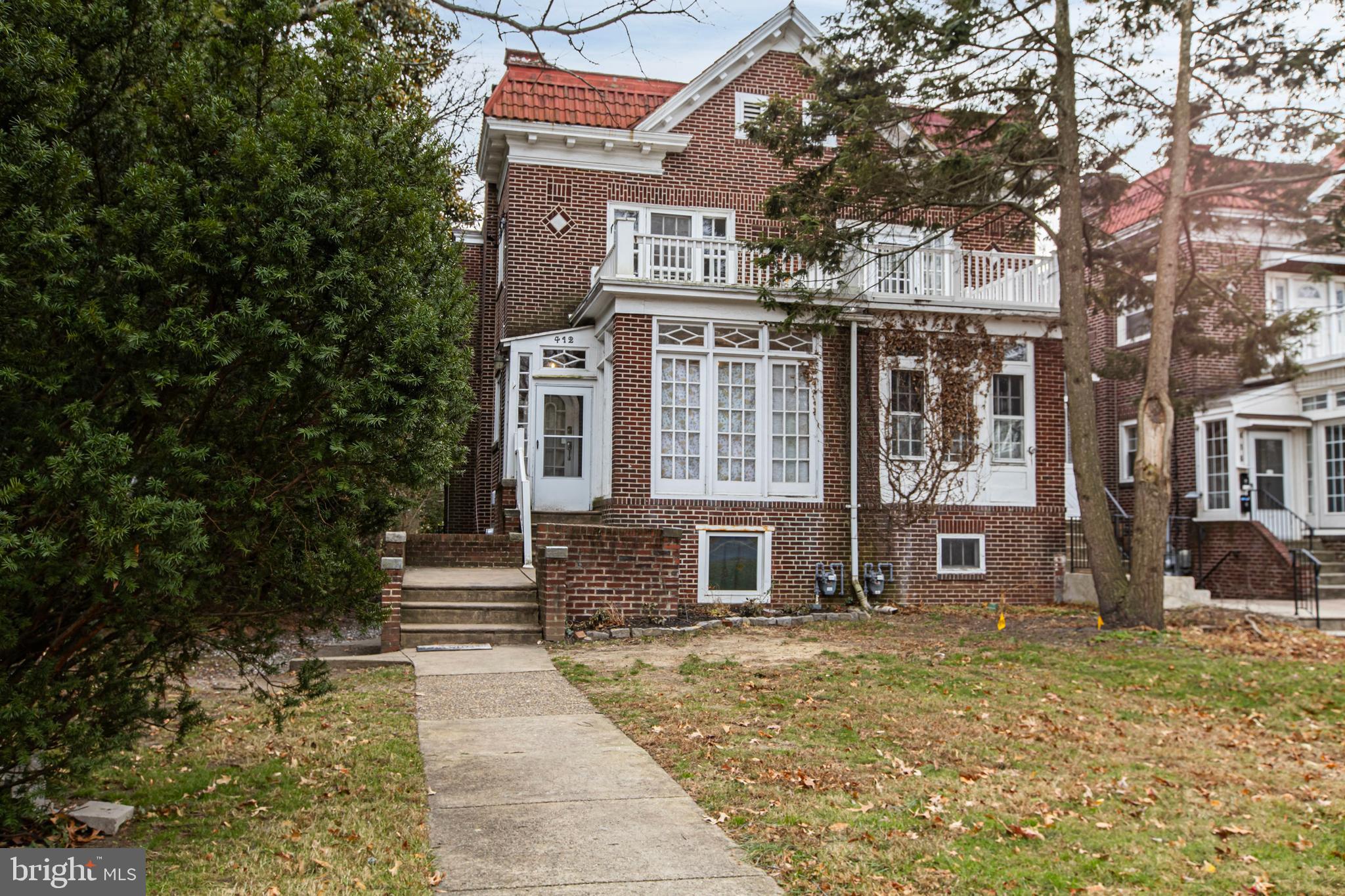 412 West Maple Avenue Merchantville, NJ 08109 - Photo 3 of 58 a front view of a house with a yard