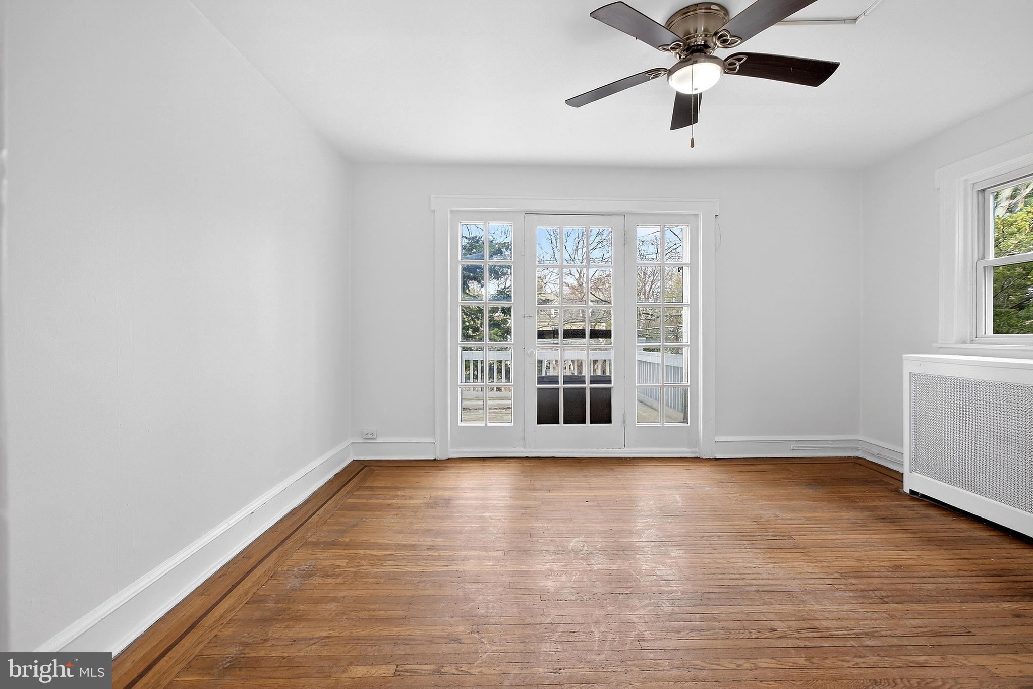 412 West Maple Avenue Merchantville, NJ 08109 - Photo 35 of 58 a view of wooden floor and windows in a room