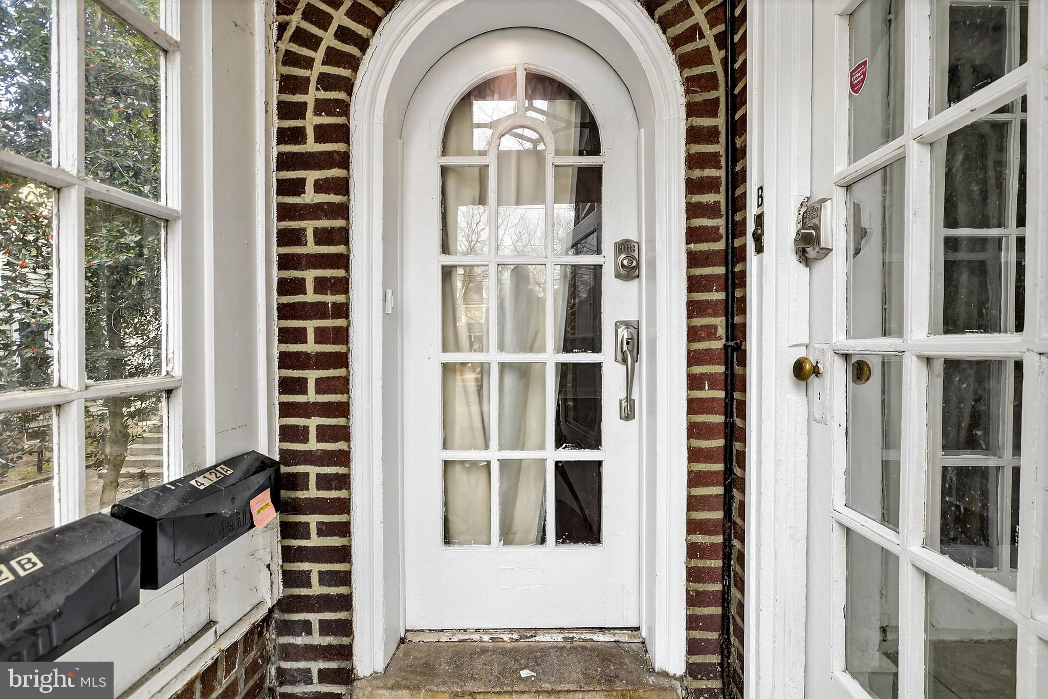 412 West Maple Avenue Merchantville, NJ 08109 - Photo 4 of 58 a front view of a house with a large window