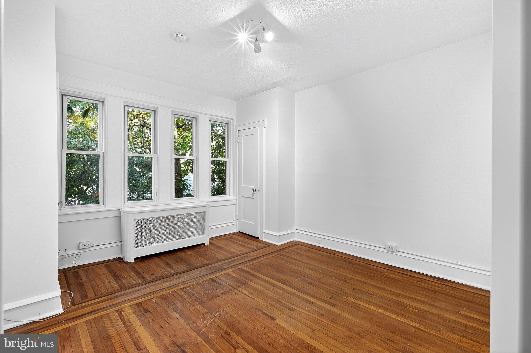412 West Maple Avenue Merchantville, NJ 08109 - Photo 43 of 58 wooden floor in an empty room with a window
